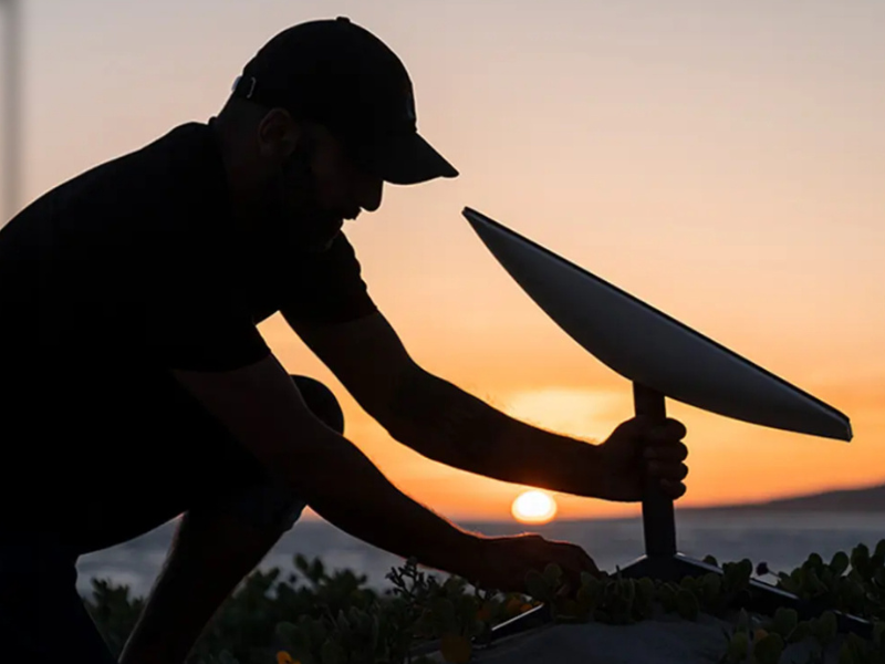 A technician mounting a dish during a North Carolina Starlink installation job.