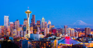 Experienced Starlink installers in Seattle, WA, setting up a satellite dish with the iconic Space Needle in the background.